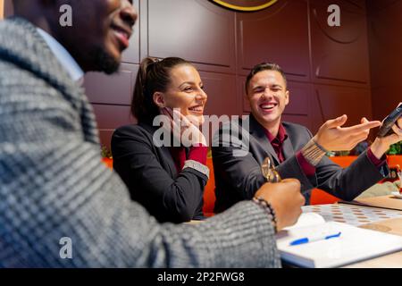 Group of multiracial busniess people are having a discussion about the company and laughing Stock Photo