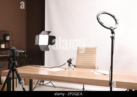 Modern blogger's workplace with professional equipment in room Stock ...