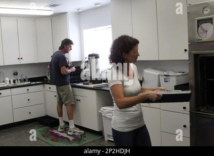 John Rutter, raspberry lab manager at Lassen Canyon Nursery, and Amber  Galusha work on Tuesday, Aug. 18, 2015, in the raspberry lab at the  Redding, Calif., business. The business is moving to