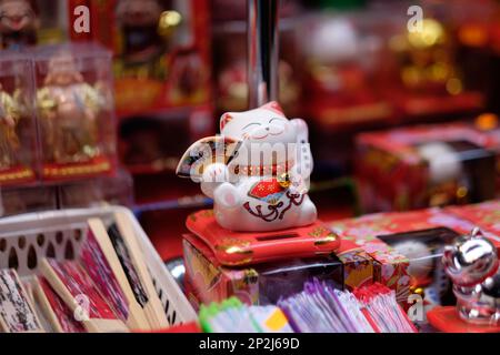 Lucky cat in Chinatown showcase, London Stock Photo