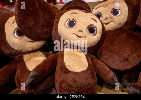 A soft toy Cheburashka lies on the counter of a children's store in Moscow, Russia. Cheburashka is a fictional character created by Soviet writer Eduard Uspensky in his 1965 children's book Gena the Crocodile and His Friends. Stock Photo