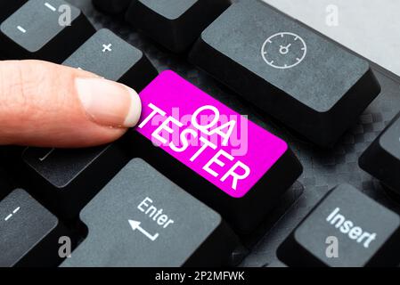 Writing displaying text Qa Tester. Word for Quality assurance of an on going project before implementation Stock Photo