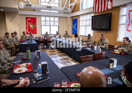 U.S Army Maj. Gen. David Wilson, Commanding General of Army Sustainment Command (ASC), enjoys lunch at the Falcon Café Warrior Restaurant on Fort Bragg, N.C. Feb. 16. Wilson attended a The Rocks, Inc. luncheon while touring 406th Army Field Support Brigade. Stock Photo