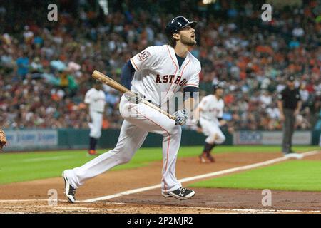 Dustin Pedroia of the Boston Red Sox throws over L.J. Hoes of the