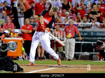 National League's Todd Frazier holds up the Home Run Derby trophy after  defeating Joc Pederson in the Home Run Derby during the 86th All-Star Game  at Great American Ball Park in Cincinnati