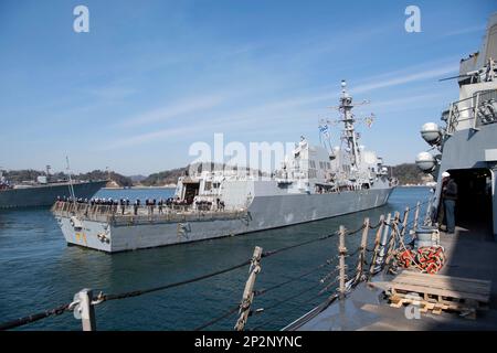 YOKOSUKA, Japan (March 4, 2023) The Arleigh Burke-class guided-missile destroyer USS John Finn (DDG 113) arrives at Commander Fleet Activities Yokosuka (CFAY). Finn arrives from Naval Base San Diego to CFAY, becoming the latest forward-deployed asset in the U.S. 7th Fleet. For 75 years, CFAY has provided, maintained, and operated base facilities and services in support of the U.S. 7th Fleet's forward-deployed naval forces, tenant commands, and thousands of military and civilian personnel and their families. (U.S. Navy photo by Mass Communication Specialist 1st Class Kaleb J. Sarten) Stock Photo