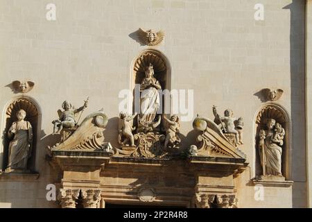 Galatina, Italy. Exterior view of the 17th century Catholic Church of the Saints Peter and Paul. Statues of saints over the richly decorated portal. Stock Photo