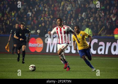 Paraguay s Roque Santa Cruz dribbles against Brazil during the