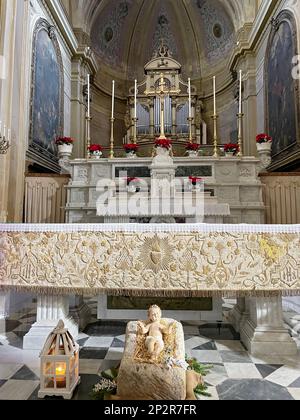 Galatina, Italy. Interior of the 17th century Catholic Church of the Saints Peter and Paul. A Christmas display in front of the altar. Stock Photo