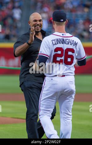 Former Atlanta Braves player David Justice, right, hugs Braves