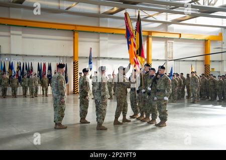 12th Combat Aviation Brigade (12 CAB), Soldiers, Family and members of the Ansbach community, gathered for the Change of Responsibility Ceremony for the outgoing Command Sergeant Major, Command Sgt. Maj. Zane B. Hansen to the incoming Command Sergeant Major, Command Sgt. Maj. Kyle P. Clutter. The ceremony took place in Hangar 2 on the Katterbach Airfield, Ansbach, Germany, Feb. 16, 2023. Stock Photo