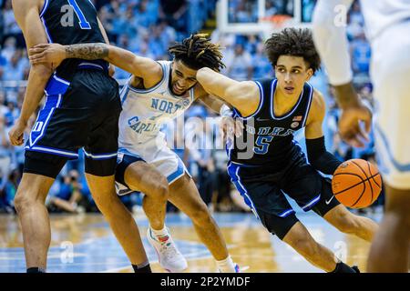 March 4, 2023: North Carolina Tar Heels guard R.J. Davis (4), center runs into the screen from Duke Blue Devils center Dereck Lively II (1), left, as guard Tyrese Proctor (5) drives to the basket during the second half of the ACC basketball matchup at Dean Smith Center in Chapel Hill, NC. (Scott Kinser/CSM) Stock Photo