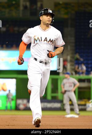 MIAMI, FL - AUGUST 22: New York Yankees left fielder Giancarlo Stanton (27)  runs out to right field during the fourth inning in a game between the  Miami Marlins and the New