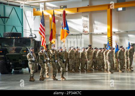 12th Combat Aviation Brigade (12 CAB), Soldiers, Family and members of the Ansbach community, gathered for the Change of Responsibility Ceremony for the outgoing Command Sergeant Major, Command Sgt. Maj. Zane B. Hansen to the incoming Command Sergeant Major, Command Sgt. Maj. Kyle P. Clutter. The ceremony took place in Hangar 2 on the Katterbach Airfield, Ansbach, Germany, Feb. 16, 2023. Stock Photo