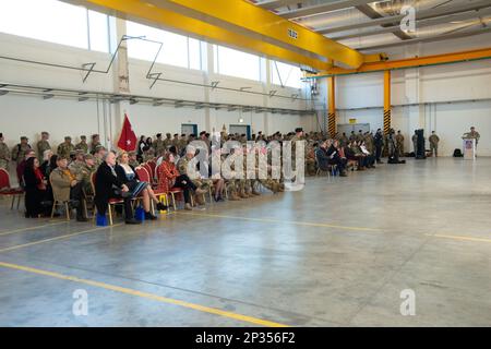 12th Combat Aviation Brigade (12 CAB), Soldiers, Family and members of the Ansbach community, gathered for the Change of Responsibility Ceremony for the outgoing Command Sergeant Major, Command Sgt. Maj. Zane B. Hansen to the incoming Command Sergeant Major, Command Sgt. Maj. Kyle P. Clutter. The ceremony took place in Hangar 2 on the Katterbach Airfield, Ansbach, Germany, Feb. 16, 2023. Stock Photo