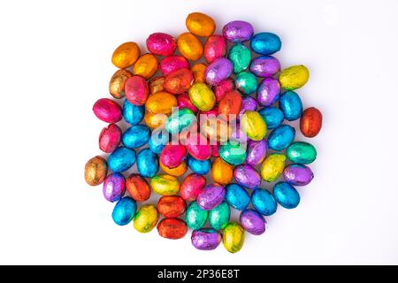 Colourful Easter sweets, chocolate eggs on a white background Stock Photo