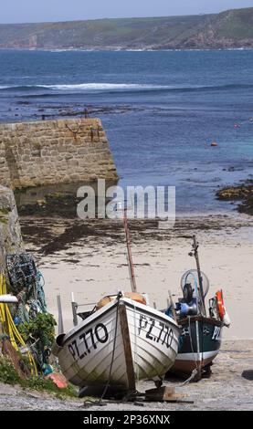Area of Sennen, England. Fishing boats at Sennen Cove Harbour with the ...