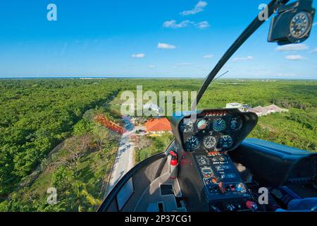 View from cockpit of helicopter type Bell 206B Jet Ranger III on approach, landing field, runway, instruments, visual flight, low-level flight Stock Photo