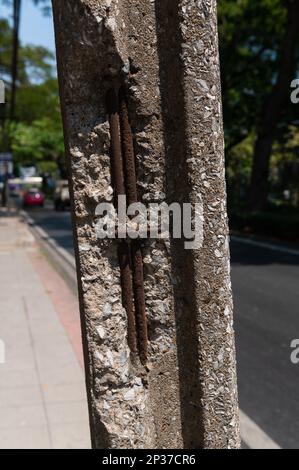Electric concrete poles with cracks on pavement Stock Photo