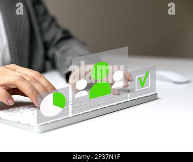 Infographic of employee assessment, HRM manager working on computer with virtual screen. Stock Photo