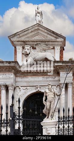 The main entrance to the Venetian Arsenal and Naval Museum with a statue of Neptune on the right (vertical photo) Stock Photo