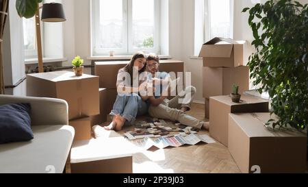 Young married couple of new homeowners selecting finishing interior materials Stock Photo