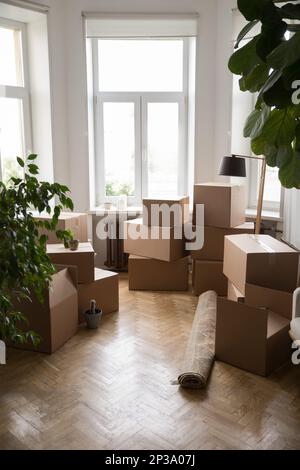Stacks of cardboard boxes packed for moving, transportation Stock Photo