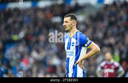 Lewis Dunk of Brighton during the Premier League match between Brighton & Hove Albion and West Ham United at The American Express Community Stadium , Brighton , UK - 4th March 2023  Photo Simon Dack/Telephoto Images.  Editorial use only. No merchandising. For Football images FA and Premier League restrictions apply inc. no internet/mobile usage without FAPL license - for details contact Football Dataco