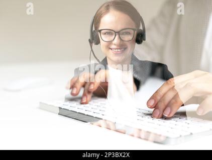 Call center agent woman with headset, composite image. Stock Photo