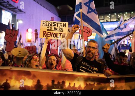 Israel. 04th Mar, 2023. Israeli protestors chant and hold signs while holding a sign against the Hawara Pogrom as they march in Tel Aviv. Over 200,000 people protested in Tel Aviv against Netanyahu's far-right government and its controversial legal reform. Mar 4th 2023. (Photo by Matan Golan/Sipa USA). Credit: Sipa USA/Alamy Live News Stock Photo