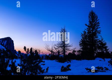 The sun sets on another snow filled day on the top of the Feuerkogul mountains in Austrian Salzkammergut Stock Photo