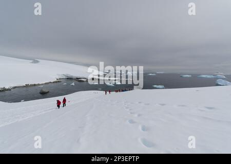 Tourists at Portal Point - Antarctica Stock Photo