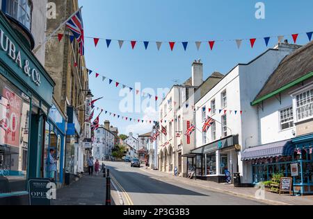 View of Broad Street shops with pennons celebrating Jubille, Lyme Regis, Dorcst, England, UK Stock Photo