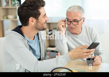 senior father and son having fun at home Stock Photo