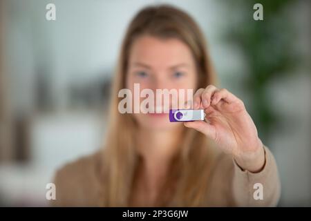 woman holding a usb memory stick Stock Photo