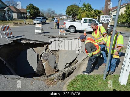 Beaumont crew workers tend to a sinkhole that appeared Tuesday