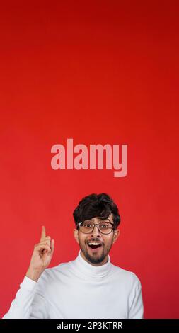 Wow idea creative insight inspired man pointing up Stock Photo