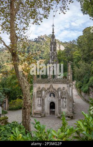 The Capela in the Quinta da Regaleira with the Moorish castle on hill behind, Sintra, Lisbon Region, Portugal, Europe Stock Photo