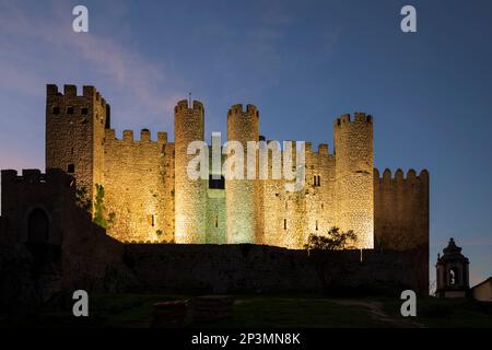 Obidos Castle floodlit at night, Obidos, Central Region, Portugal, Europe Stock Photo