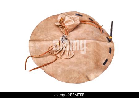 Simple retro leather bag like in the old days, isolated on a white background. Vintage wallet with ties for coins and money. Stock Photo
