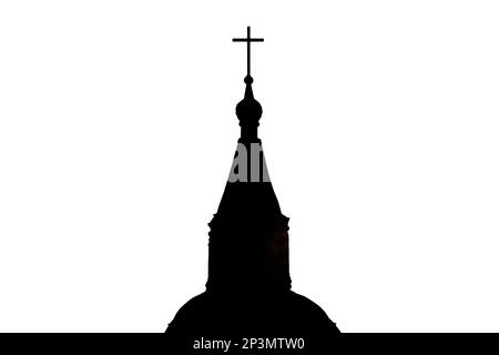 Silhouette of the catholic church at sunset, isolated on a white background. The setting sun shines on the dark christian cathedral. Stock Photo