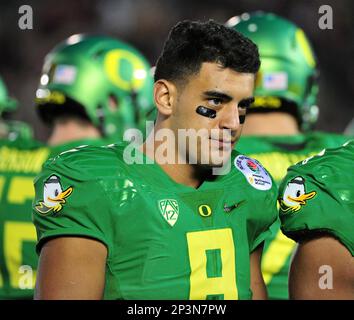 Oregon Ducks quarterback Marcus Mariota (8) drops back to pass in the first  quarter against the Florida State Seminoles at the College Football Playoff  Semifinal of the Rose Bowl in Pasadena, California