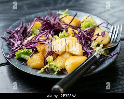 Warm Potato Salad with Red Cabbage Stock Photo
