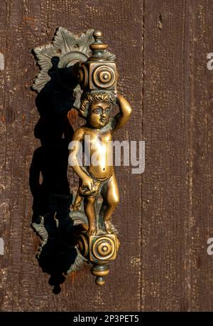 Ornate brass door handle Venice, Italy Stock Photo