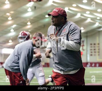 Alabama running backs coach Burton Burns works his running backs