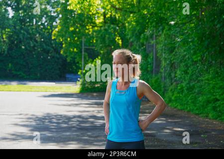 View of European women during a sport training outdoors on a public area in the summer Stock Photo