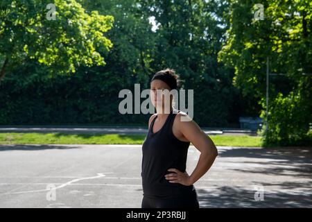 View of European women during a sport training outdoors on a public area in the summer Stock Photo