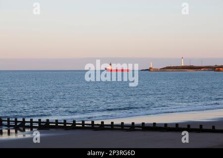 Boat sailing from Aberdeen Harbour at dusk, Scotland, UK, Europe Stock Photo