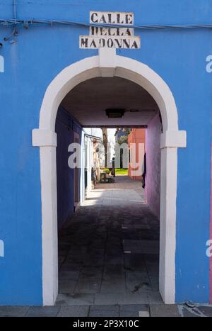 Coloured archway at Calle Del Madonna, Burano, Venice lagoon, Italy Stock Photo