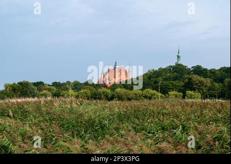 A view at famous castle with cathedral from Vistula lagoon.Astronomer Nicolaus Copernicus lived and worked here in 1521-1543. Frombork, Poland. Stock Photo